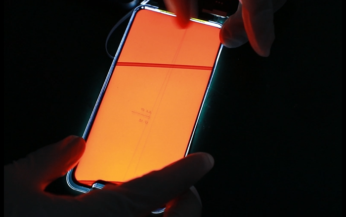 Replacement display undergoing a functional test